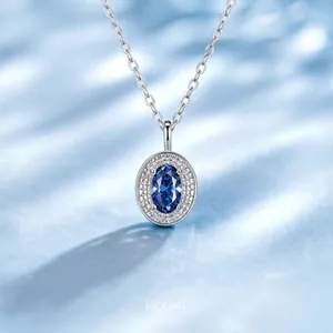 Detailed view of an elegant 925 sterling silver necklace with a blue oval gemstone pendant.