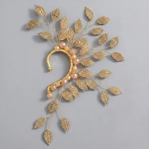 Elegant gold leaf elf ear cuff with peach crystal beads for non-pierced ears