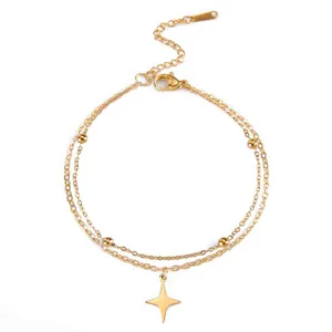 Detailed view of a gold stainless steel double-layer bracelet with a four-pointed star.