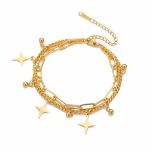 Gold stainless steel double-layer bracelet featuring four-pointed star and bead charms