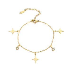 Detail view of gold-plated stainless steel bracelet with four-pointed star charms