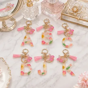 Handmade Pink Resin Letter Keychain With Real Dried Flower Gold Foil Tassel Butterfly Charm Fashion Keychain Pendant For Women Gift