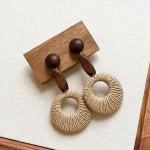 Vintage ethnic style earrings with wooden beads and round rattan woven pendants