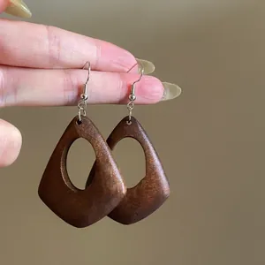 Vintage dark brown geometric hollow wooden drop earrings with elegant silver hooks
