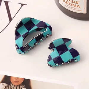 Detail of blue and turquoise checkerboard pattern imitation acetate hair claw clips
