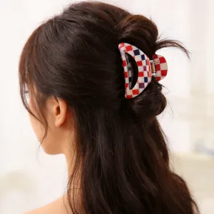 Stylish red and white checkerboard hair claw clip for elegant women's half-up hairstyles