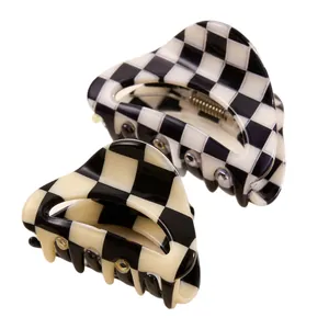 Two black and white checkerboard hair claw clips for stylish women's hair styling