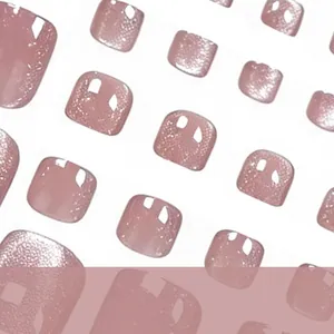 Macro detail of pink cat eye magnetic glitter press-on toenails in short square shape