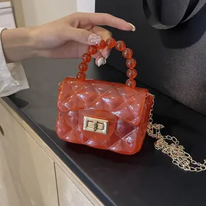 Mini sac en gelée matelassé orange transparent élégant avec poignée en perles et chaîne dorée