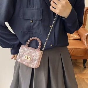 Mini sac bandoulière rose transparent en gelée avec texture matelassée et poignée en perles