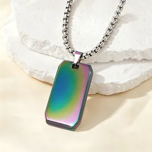 Close-up of an iridescent stainless steel dog tag necklace with a thick box chain.