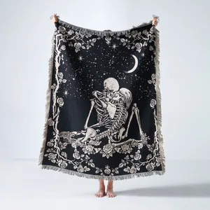Detailed view of woven Gothic skeleton throw blanket with celestial moon and rose pattern