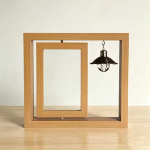 Detail view of a rotating wooden photo frame featuring a decorative hanging light bulb