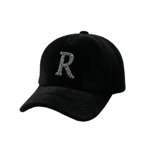 Black fuzzy winter baseball cap featuring a sparkling rhinestone letter R design for women