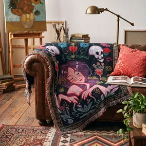 Bohemian woven throw blanket with artistic woman and skull pattern on sofa