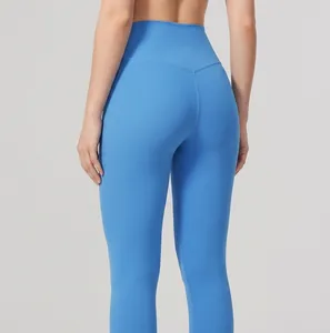 Detailed macro view of the lifting seam design on high-waisted blue athletic leggings