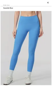 Detail of high-waisted coastal blue yoga pants worn by fitness model in studio