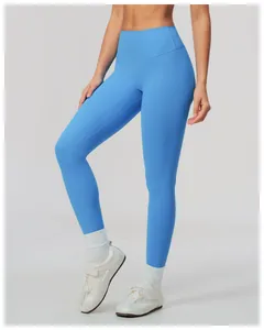 Detailed view of vibrant blue high-waisted brushed yoga leggings for athletic women's fitness.