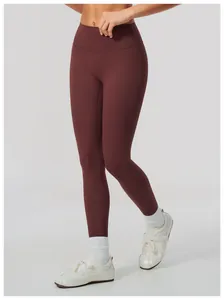 Close-up detail of high waist butt-lifting brushed yoga leggings in deep brown color
