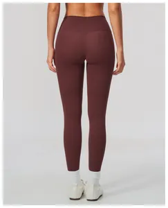 Back view detail of high-waisted maroon yoga leggings with butt-lifting effect