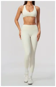 Professional studio shot of an athletic model wearing cream white high-waist yoga leggings