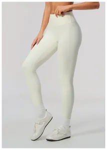 Close-up of high-waisted cream yoga leggings with brushed fabric for a lifting effect