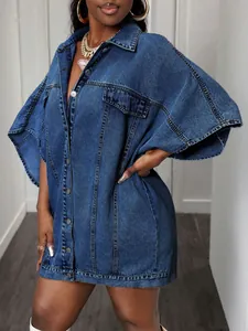 Detailed view of an oversized sleeveless denim shawl jacket featuring a loose street-style fit