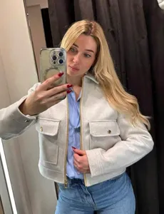 Stylish women's off-white zip-up soft jacket with front flap pockets detail view
