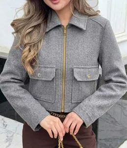 Close-up detail of a women's grey cropped zip-up jacket with wool-like texture