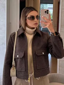 Stylish dark brown zip-up jacket for women shown in a chic mirror selfie style.