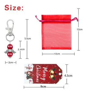 Dimensioni dettagliate per il set portachiavi angelo di Natale con sacchetto e tag regalo rosso.