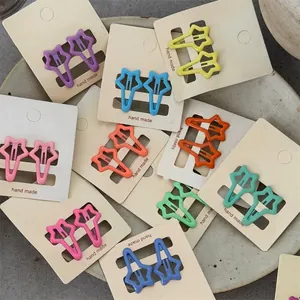 A collection of colorful star-shaped BB hair clips for girls in various bright candy colors