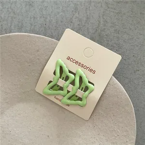 Pair of cute light green wavy star-shaped BB hair clips for children girls' hair