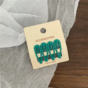 Minimalist teal water drop hair clips set of 4 on cream display card for children