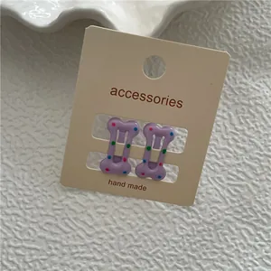 Barrettes à cheveux violettes en forme d'os avec des pois colorés pour filles