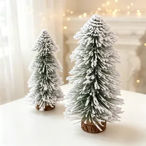 Two miniature flocked tower-shaped cedar Christmas trees with rustic wooden bases for holiday decor