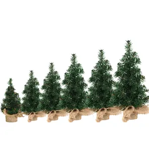 Set of six mini artificial Christmas trees with burlap bases in increasing sizes