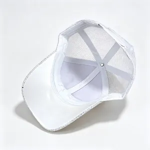 Interior detail showing breathable mesh and satin lining of a white glitter trucker hat