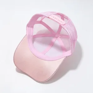 Interior detail of a pink glitter mesh trucker hat with adjustable snapback strap