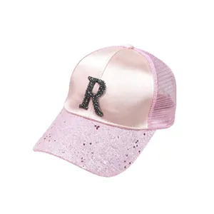 Pink satin mesh trucker hat with rhinestone letter R and glitter brim