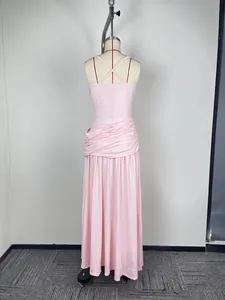 Back view of pink sleeveless evening gown with elegant draped waist and thin straps.