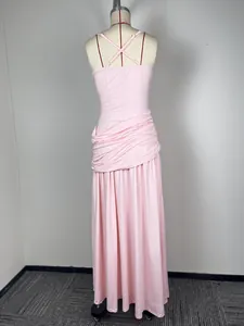 Detailed back view of pink sleeveless maxi dress with cross straps and draped waist