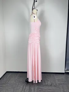 Side profile detail of elegant baby pink ruched sleeveless evening maxi prom dress for women