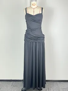 Detail view of a black sleeveless maxi dress with elegant ruched waist on a mannequin