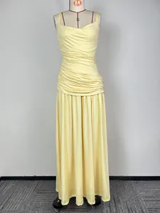 Elegant yellow sleeveless maxi dress with pleated bodice and flowing long skirt for evening.