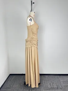 Detailed side profile of a beige sleeveless ruched maxi dress displayed on a mannequin