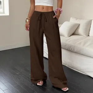 Casual brown wide-leg pants for women featuring textured fabric and drawstring waist