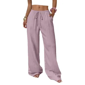 Casual women's wide-leg trousers with textured fabric and drawstring waist in mauve color