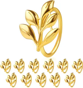 Detailed view of set of 12 elegant gold leaf napkin rings for wedding table decor.
