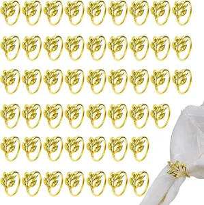Set of gold leaf napkin rings for hotel wedding decor, showing grid layout and usage